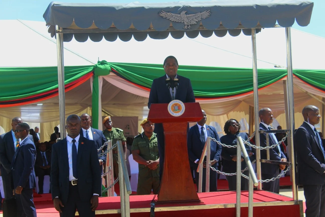A speaker addressing the Nakonde border commissioning ceremony from a podium beneath a canopy